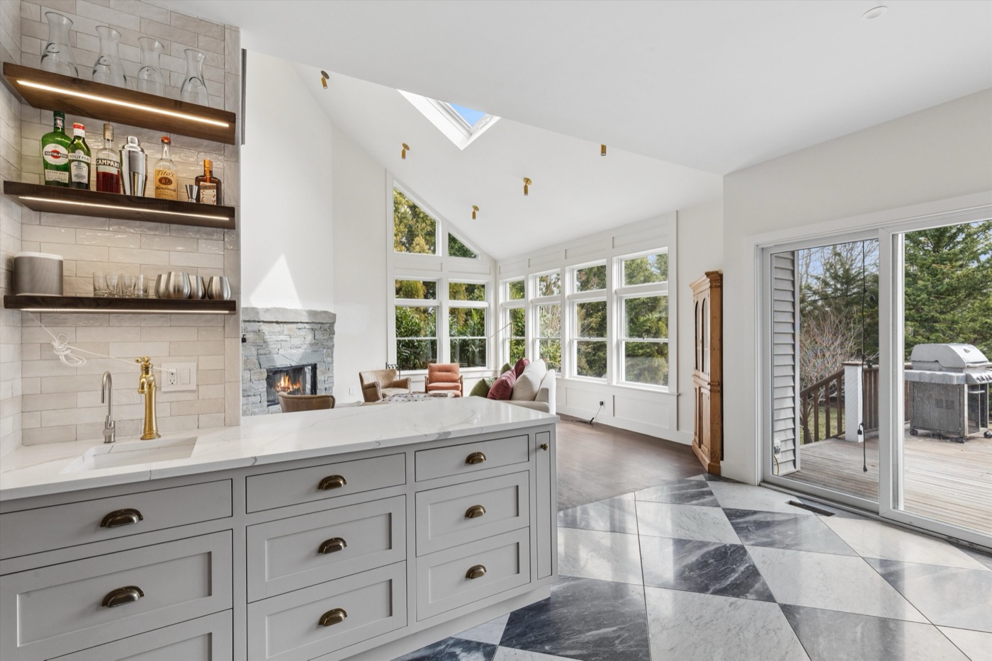 Glynn Gardens bar area — checkerboard marble floors and brass fixtures
