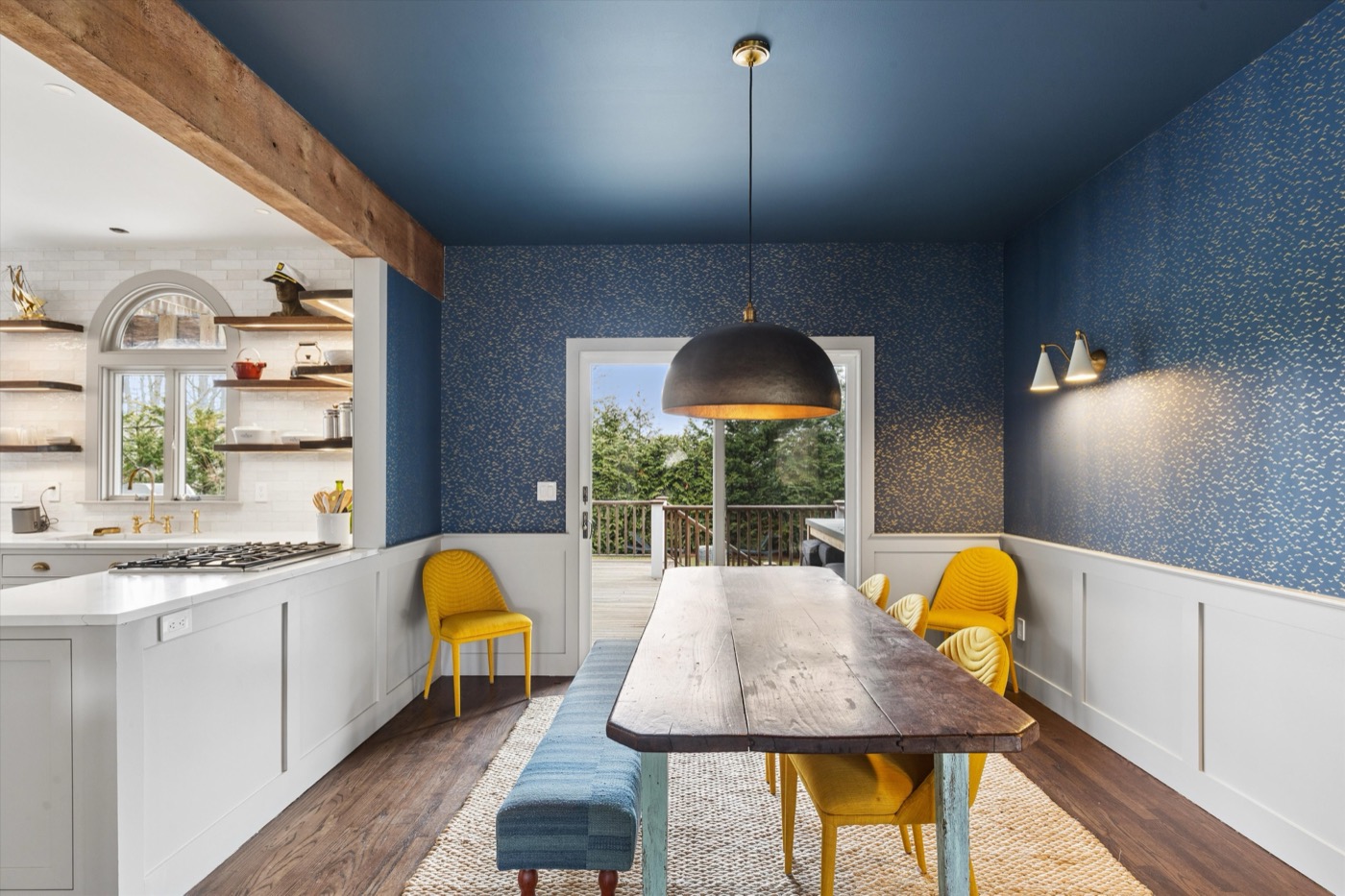 Glynn Gardens dining room — navy ceiling with yellow chairs
