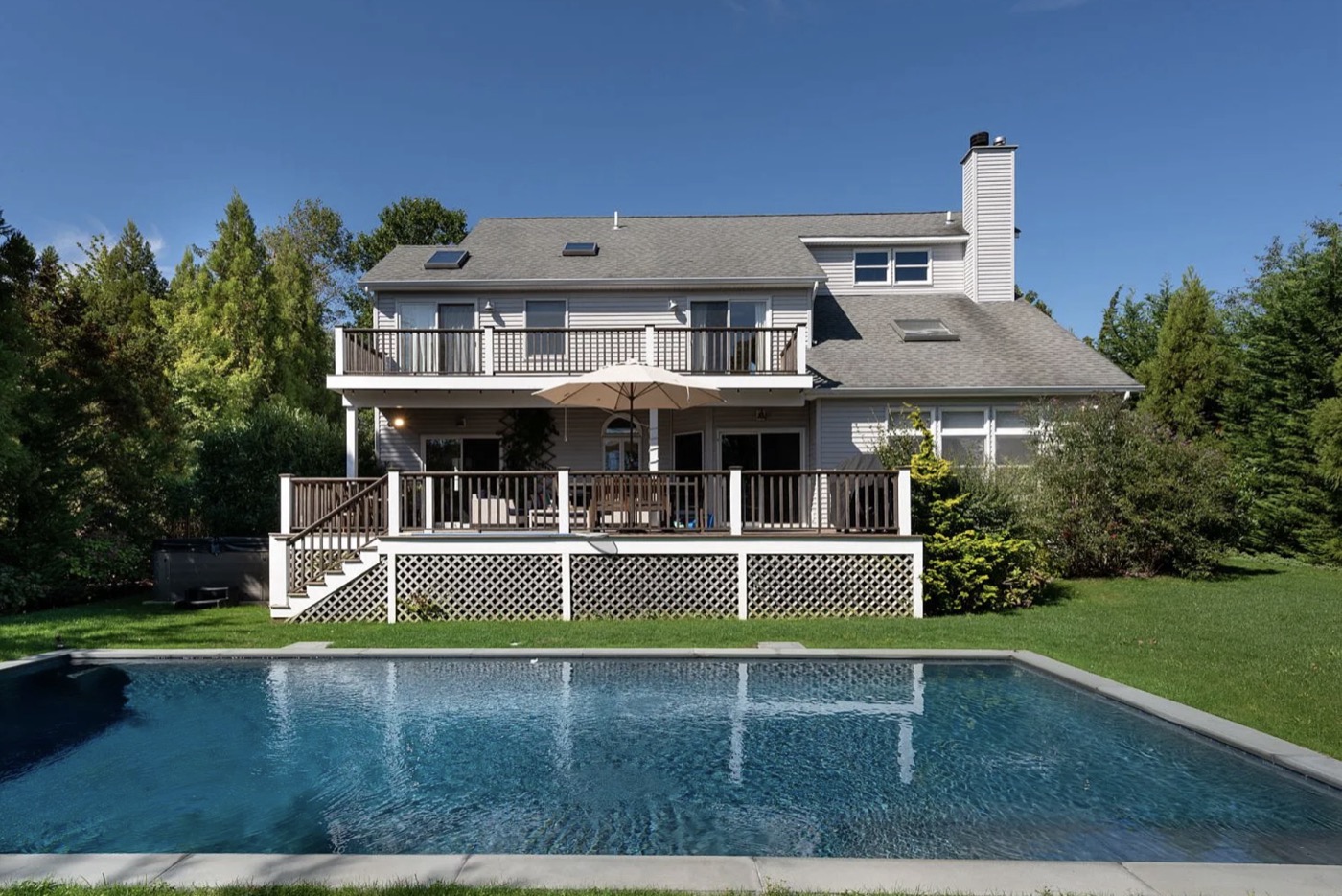 Glynn Gardens exterior — heated pool and wrap-around deck