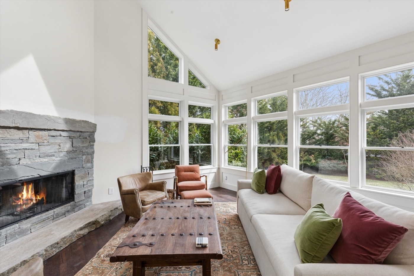 Glynn Gardens living room — stone fireplace and cathedral ceilings
